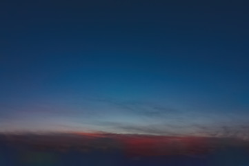The sky at sunset. Cumulus clouds lit by the rays of the setting sun.
