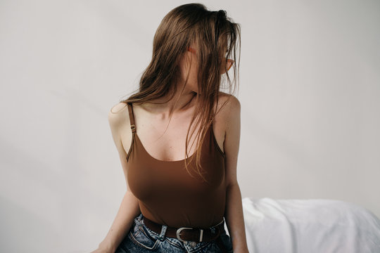 Beautiful woman posing on bed