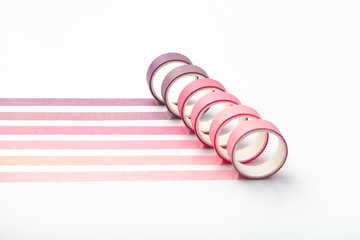 Adhesive tape rolls and parallel strips on white background