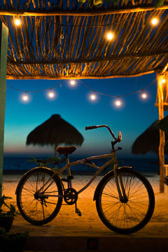 Cruiser bicycle on the beach in Mexican resort in the evening