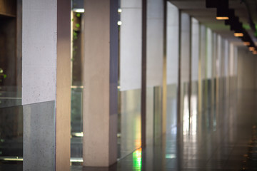 Concrete wall with glass inserts as a balustrade and decorative element.