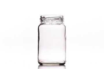 Closeup shot of an empty glass jar isolated on a white background