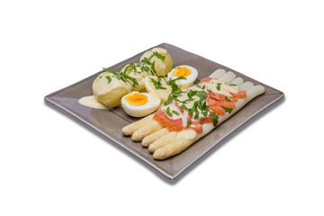Delicious seasonal white asparagus with baby boiled potatoes and smokes salmon