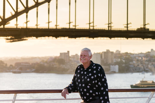 man standing under Sydney Harbor Bridge