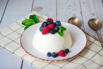 panna cotta, decorated with fresh berries