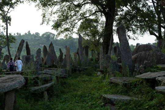 Mother and daughter walking though tombstones