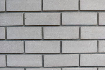 Texture of white silicate brick wall with cement mortar. Bricklaying background