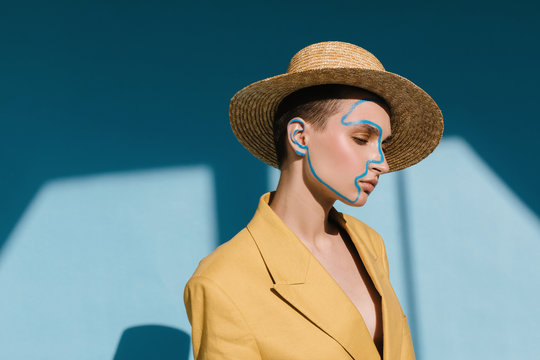 Stylish woman with paint on face