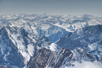 Fototapeta na wymiar Endless mass of snowy ridges, peaks and rock faces of Mieminger Kette and Stubaier Alpen ranges in spring sunshine from Zugspitze, Northern Limestone Alps / Central Eastern Alps Tyrol Austria Europe