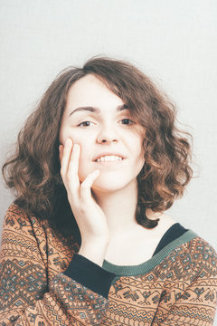 woman, put her hands to the face