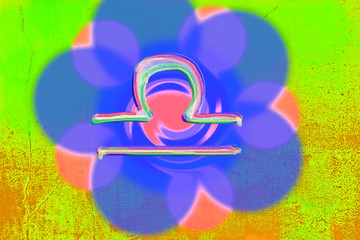 Astrological symbol of the horoscope Libra on the background of an abstract flower
