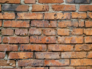Obraz premium Close up old ragged red brick wall.