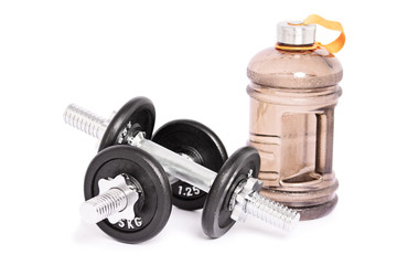 Two stainless steel dumbbells and a large water bottle