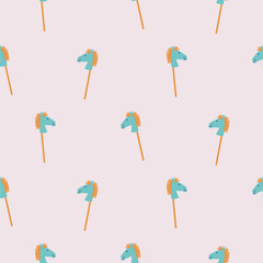 Seamless pattern with rocking horse sticks. Cute baby toy background. Pastel colors child play texture.