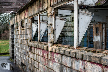 Broken Windows of Derelict Building in Abandoned Mental Hospital
