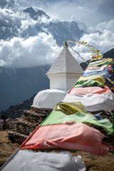 Prayer Flags and Buddhist Stupa Battered by Himalayan Wind