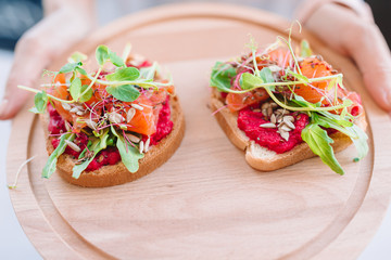Tasty italian bruschetta on the wooden plate
