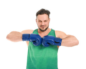 Sporty man with boxing gloves on white background