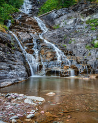 Silky Waterfall over Rocks in Glacier National Park