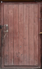 Old wooden brown door, brown boards, vintage decrepit texture