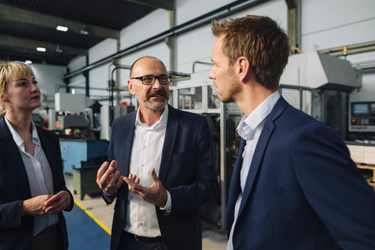 Business team having a meeting in a factory