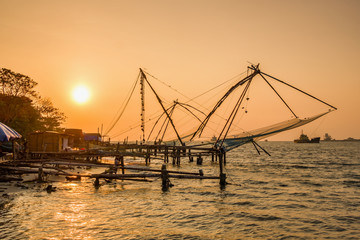 Fototapeta na wymiar Chinese fishing net at sunrise in Cochin, Kerala, India
