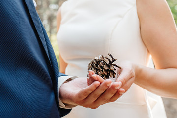 the bride and groom tenderly hold hands between them love and relationships
