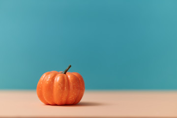 Orange pumpkin mockup, copy space. Gourd on blurred background. Symbol of autumn. Harvest festival. Halloween concept