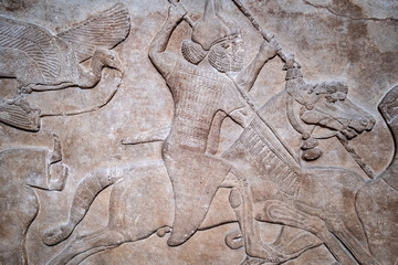 Ancient persian bas-relief depicting warriors on horseback