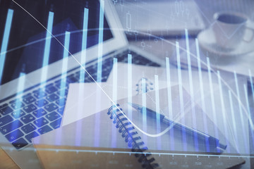 Double exposure of financial chart drawing and desktop with coffee and items on table background. Concept of forex market trading