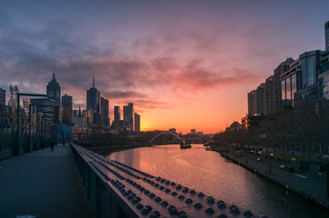 Melbourne cityscape at sunrise with Melbourne CBD skyscrapers and Southbank