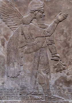 Ancient persian bas-relief depicting a winged god