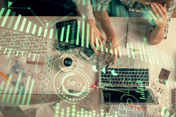 Obraz premium Double exposure of man and woman working together and technology theme drawing. Computer background. Top View. High tech concept.
