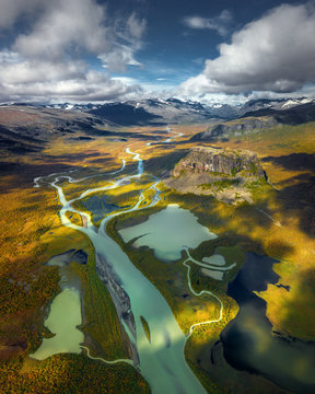 Aerial view of Sarek National Park,   Jokkmokk Municipality, Lapland in northern Sweden with river delta and big rockformation, view from  landmark Skierfe