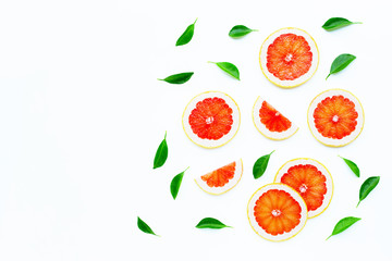 High vitamin C. Juicy grapefruit slices with leaves on white