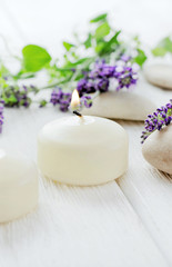 Fototapeta na wymiar lavender candles, aromatherapy flowers