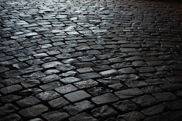  background texture old road from large old stones leaves in perspective
