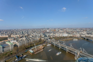 Fototapeta na wymiar A panoramic aerial view of the Thames river at the Hungerford Bridge crossing in London UK.