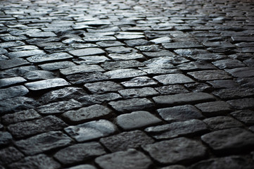  background texture old road from large old stones leaves in perspective