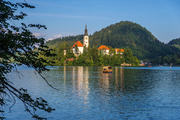 Obraz premium Amazing Bled Lake at sunset with church dedicated to the Assumption of Mary on a small island