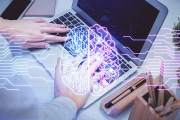 Multi exposure of woman hands working on computer and brain hologram drawing. Ai concept.