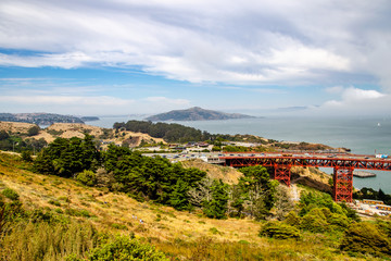 Fototapeta na wymiar Cars drive over Golden Gate Bridge in San Francisco