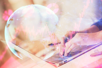 Double exposure of woman hands typing on computer and business theme hologram drawing. Success concept.