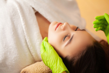 Obraz na płótnie Canvas Cute woman getting spa treatments at beauty studio