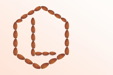 Letter L of the English alphabet from nuts in hexagon shape. Food pattern made from nuts alphabet for shop and diet