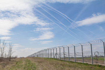 Border fence between Rastina (Serbia) & Bacsszentgyorgy (Hungary). This border wall was built in 2015 to stop the incoming refugees & migrants during the refugees crisis, on Balkans Route.