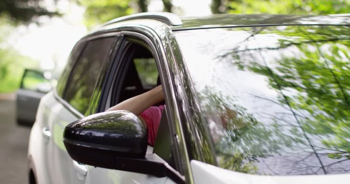 4K Policeman arresting a driver & taking out handcuffs. Slow motion.