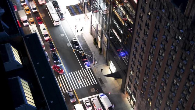 NEW YORK CITY - DECEMBER 2018: Aerial overhead view of Manhattan night traffic and firefighters truck in slow motion, New York City, USA