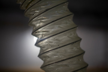 Ribbed tube made of transparent plastic.