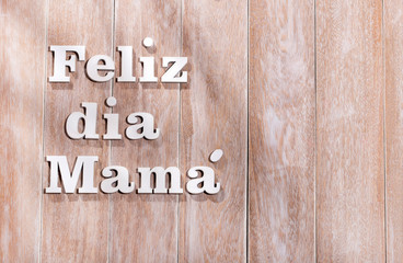 Happy mother's day, phrase in Spanish language in wooden letters